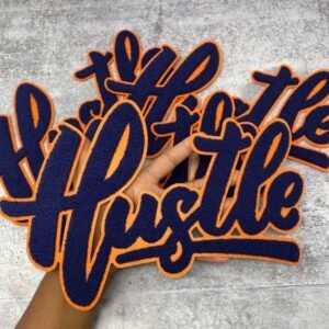 Custom embroidered script lettering in orange and navy thread