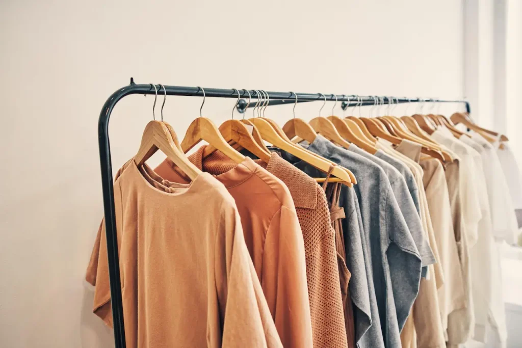 Different shirt styles arranged on a rack for workplace clothing selection