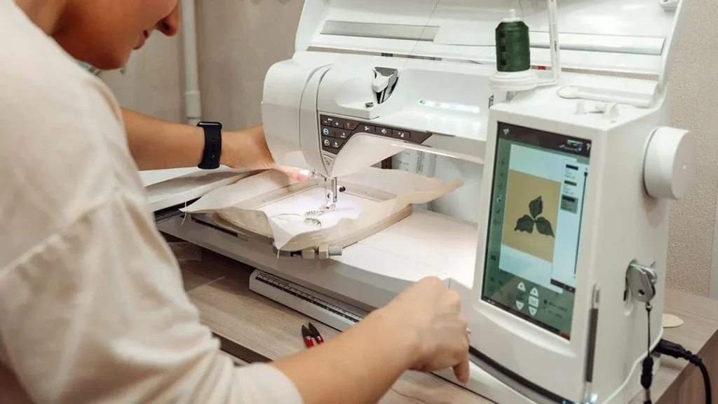 Computerized embroidery machine used to stitch designs onto clothing