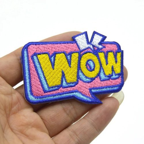 WoW Design Logo on a custom woven patch by IDC-Embroidery