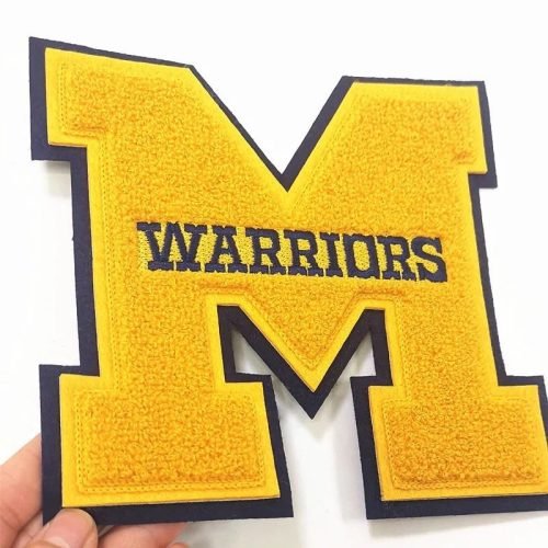 Warriors written on a big M on Custom Embroidery patches  by idc-embroidery